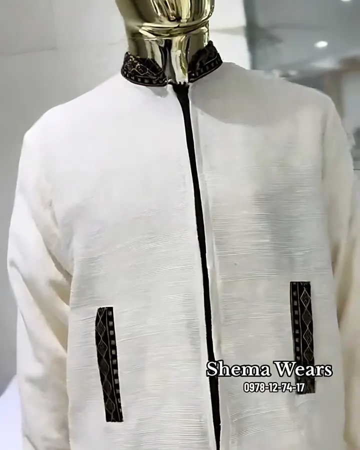 Men’s long-sleeve white shema shirt with a dark placket, tibeb collar and two tibeb pockets