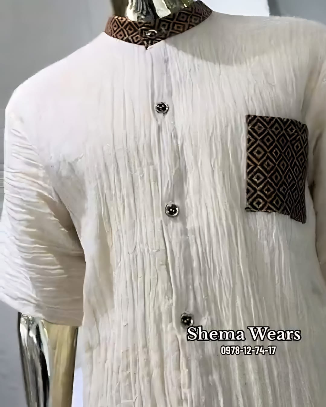Men’s textured white shema shirt with a brown tibeb collar, button front and tibeb chest pocket